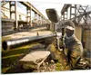 Bilder auf glas - Paintball Pistole Spieler - 100x70cm - Produktbild-Vorschau 1