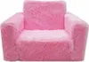 A fluffy pink children's armchair is shown from the front against a white background. Podgląd zdjęcia produktu