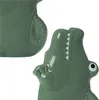 Close-up of a green ceramic crocodile-shaped water tank for a radiator. Produktbild-Vorschau