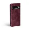 A burgundy flip cover case for a Google Pixel 7 Pro, shown from a side-angle. Produktbild-Vorschau