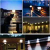 A collage of images showing solar lights installed in various outdoor settings, including a fence, a wall, and the roofline of a house, with a cat in one of the images. Produktbild-Vorschau