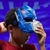 A child wearing a blue and gray Transformers Optimus Prime mask. Anteprima dell’immagine prodotto