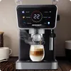 A coffee machine is brewing coffee into a glass cup, with steam rising. Produktbild-Vorschau