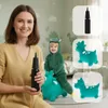 A woman holds a black pump while a child in a dinosaur costume rides a green inflatable dinosaur in the background. Podgląd zdjęcia produktu