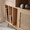 A close-up of a wooden record cabinet with records and headphones. Anteprima dell’immagine prodotto