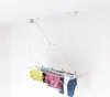 A ceiling-mounted clothes drying rack with laundry hanging on it, set against a plain white background. Podgląd zdjęcia produktu