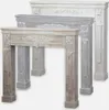 Three wooden fireplace mantels of different colors are displayed side-by-side. Anteprima dell’immagine prodotto