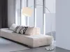 A modern living room with a white sofa and a floor lamp. Náhled obrázku produktu