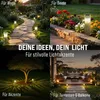 A collage of four images showing solar garden lights used in different outdoor settings: a pathway, flower beds, under a tree, and on a patio/balcony. Anteprima dell’immagine prodotto