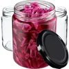 Three glass jars, one filled with red cabbage and two empty, with a black lid in the foreground. Podgląd zdjęcia produktu