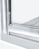 A close-up view of the bottom corner of a shower enclosure, showing the chrome trim and white base. Podgląd zdjęcia produktu