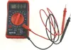 A red digital multimeter with black and red test leads is shown against a white background. Produktbild-Vorschau