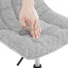 A hand is pressing into a soft, textured gray cushion, likely demonstrating its comfort. Produktbild-Vorschau