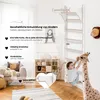 A child is playing on a wooden climbing frame in a room with furniture and toys. Voir les images du produit