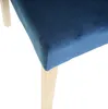 Close-up of a blue velvet chair seat and a light-colored wooden leg. Produktbild-Vorschau