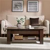 A living room scene with a couch and coffee table. Produktbild-Vorschau