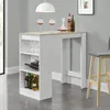 A white and wood-tone bar counter with shelves for bottles and glasses, set against a light gray wall. Náhled obrázku produktu