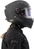 A person wearing a black motorcycle helmet and jacket, shown from the side. Anteprima dell’immagine prodotto