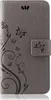 A gray flip cover wallet case for a Xiaomi Redmi Note 8 Pro, decorated with a floral and butterfly design. Produktbild-Vorschau