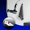 A hairdryer and towel are mounted on a wall, with a graphic of a person relaxing in the foreground. Produktbild-Vorschau