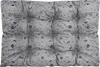 A tufted cushion with a pattern of paw prints and bones on a gray background. Voir les images du produit