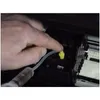 A hand is using a syringe with a tube to inject fluid into a printer's print head. Produktbild-Vorschau