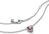 A close-up view of a silver necklace with a pink heart-shaped pendant. Podgląd zdjęcia produktu