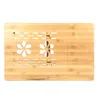 A top-down view of a wooden laptop table with decorative cutouts. Produktbild-Vorschau