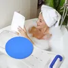 A woman is taking a bath while reading a book. Náhľad obrázku produktu