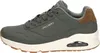 A side view of a single green sneaker. Voir les images du produit