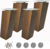 Four wooden furniture legs with metal plates on top, along with screws and felt pads, are displayed against a white background. Podgląd zdjęcia produktu