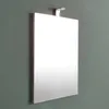 A rectangular mirror with a silver frame and a small LED lamp attached to the top, mounted on a gray wall. Anteprima dell’immagine prodotto