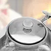 A close-up view of the lid and handle of a teapot. Produktbild-Vorschau