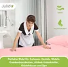 A hotel maid making a bed with pink sheets. Produktbild-Vorschau