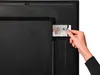 A hand inserts a smart card into a slot on the back of a television. Náhľad obrázku produktu