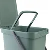 A close-up view of a green plastic waste bin with its lid open and a gray handle. Podgląd zdjęcia produktu