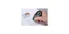 A hand is using a correction tape dispenser on a piece of paper. Produktbild-Vorschau