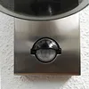 A close-up view of a motion sensor on a wall-mounted light fixture. Produktbild-Vorschau