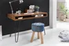 A wooden desk with a lamp, radio, and books, next to a denim stool in a room. Anteprima dell’immagine prodotto