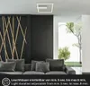 A modern living room with a sofa and a ceiling light. Anteprima dell’immagine prodotto