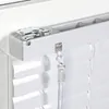 A close-up view of the top mechanism of white Venetian blinds, showing the mounting bracket and control cords. Produktbild-Vorschau
