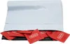 A pile of Durex condoms in red individual wrappers, spilling out of a white envelope. Náhled obrázku produktu
