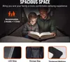 A father and son reading a book inside a tent. Produktbild-Vorschau