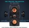 A black Bluetooth speaker with orange speaker cones, shown with side views of individual speaker components and text overlays describing its features. Podgląd zdjęcia produktu