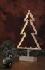 A decorative Christmas tree light on a wooden surface with a blurred background. Produktbild-Vorschau
