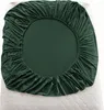 A dark green fitted sheet is laid out on a white mattress. Náhled obrázku produktu