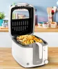 A white and gray Tefal deep fryer filled with french fries, placed on a wooden countertop with kitchen items in the background. Produktbild-Vorschau
