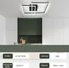 A modern kitchen with white cabinets and a dark green backsplash, featuring a contemporary black and white geometric ceiling light. Náhľad obrázku produktu