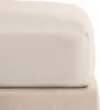 A close-up view of a fitted sheet on a bed. Produktbild-Vorschau