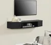A black TV wall shelf mounted on a light-colored wall, displaying a TV, a DVD player, a game controller, a vase, and a clock. Anteprima dell’immagine prodotto